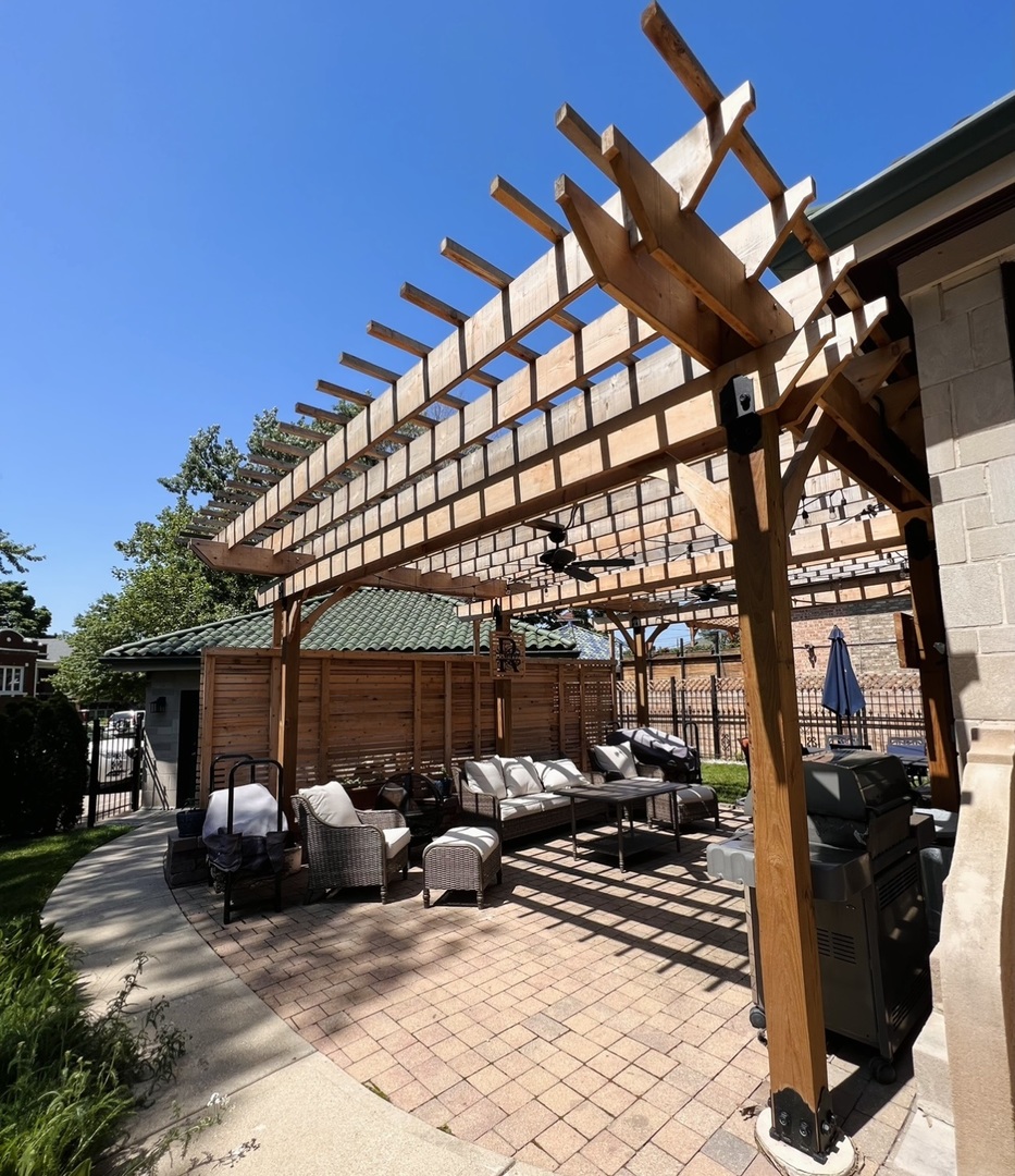 6849 Riverside Drive Berwyn, IL 60402 - Photo 29 of 33 a view of a patio with table and chairs and potted plants