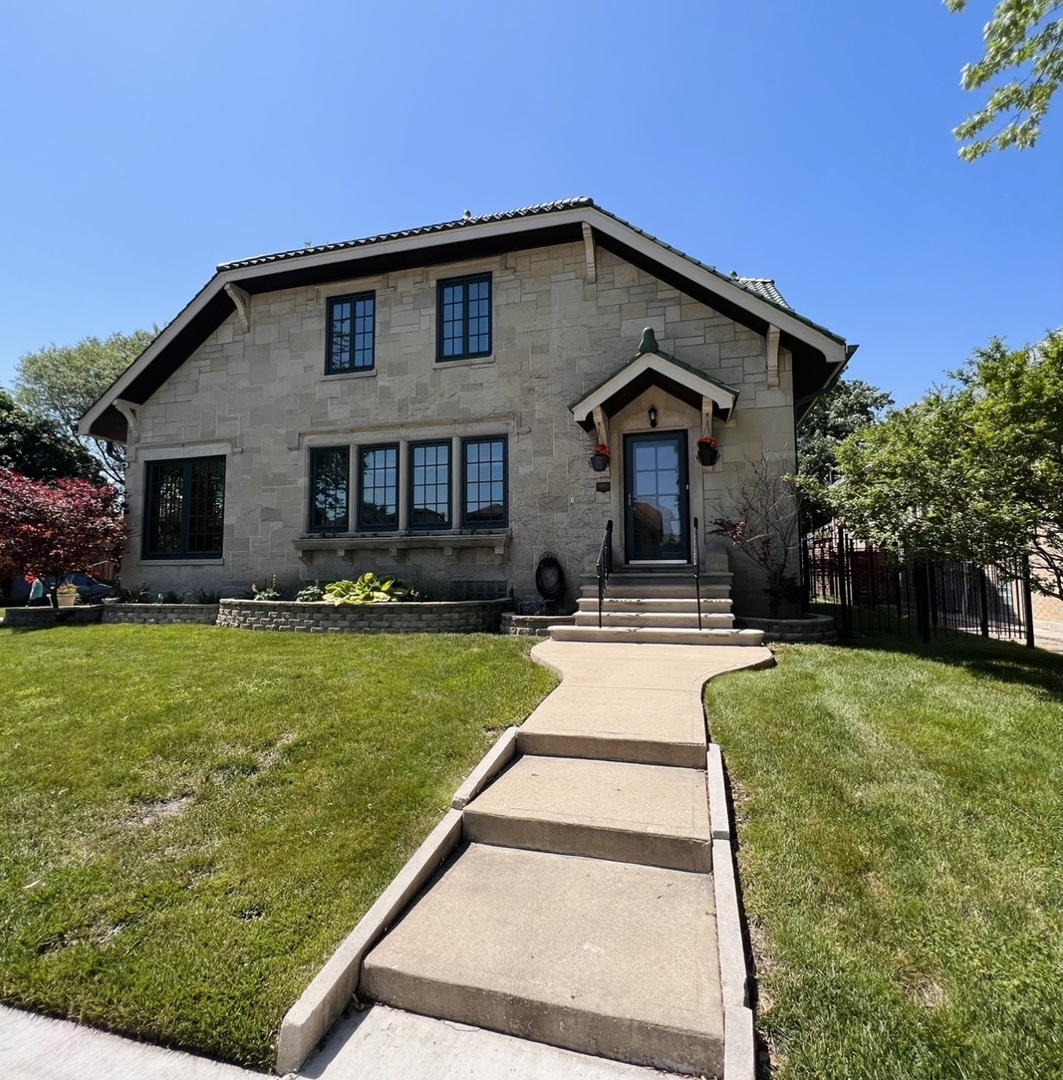 6849 Riverside Drive Berwyn, IL 60402 - Photo 3 of 33 a front view of a house with a yard