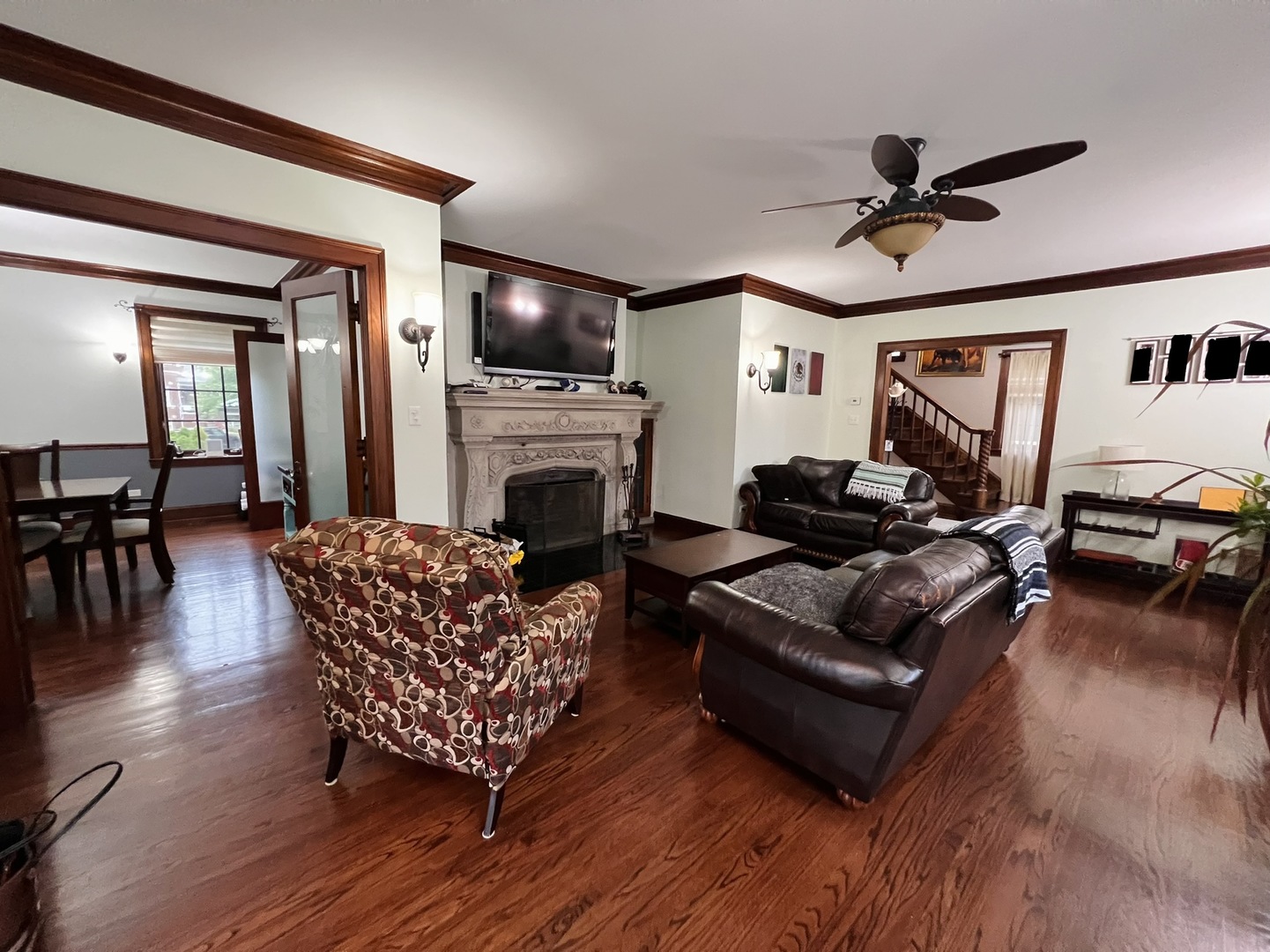 6849 Riverside Drive Berwyn, IL 60402 - Photo 6 of 33 a living room with furniture a flat screen tv and a fireplace