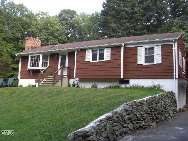 45 Key Rock Road Newtown, CT 06470 - Photo 1 of 1 a front view of a house with a garden