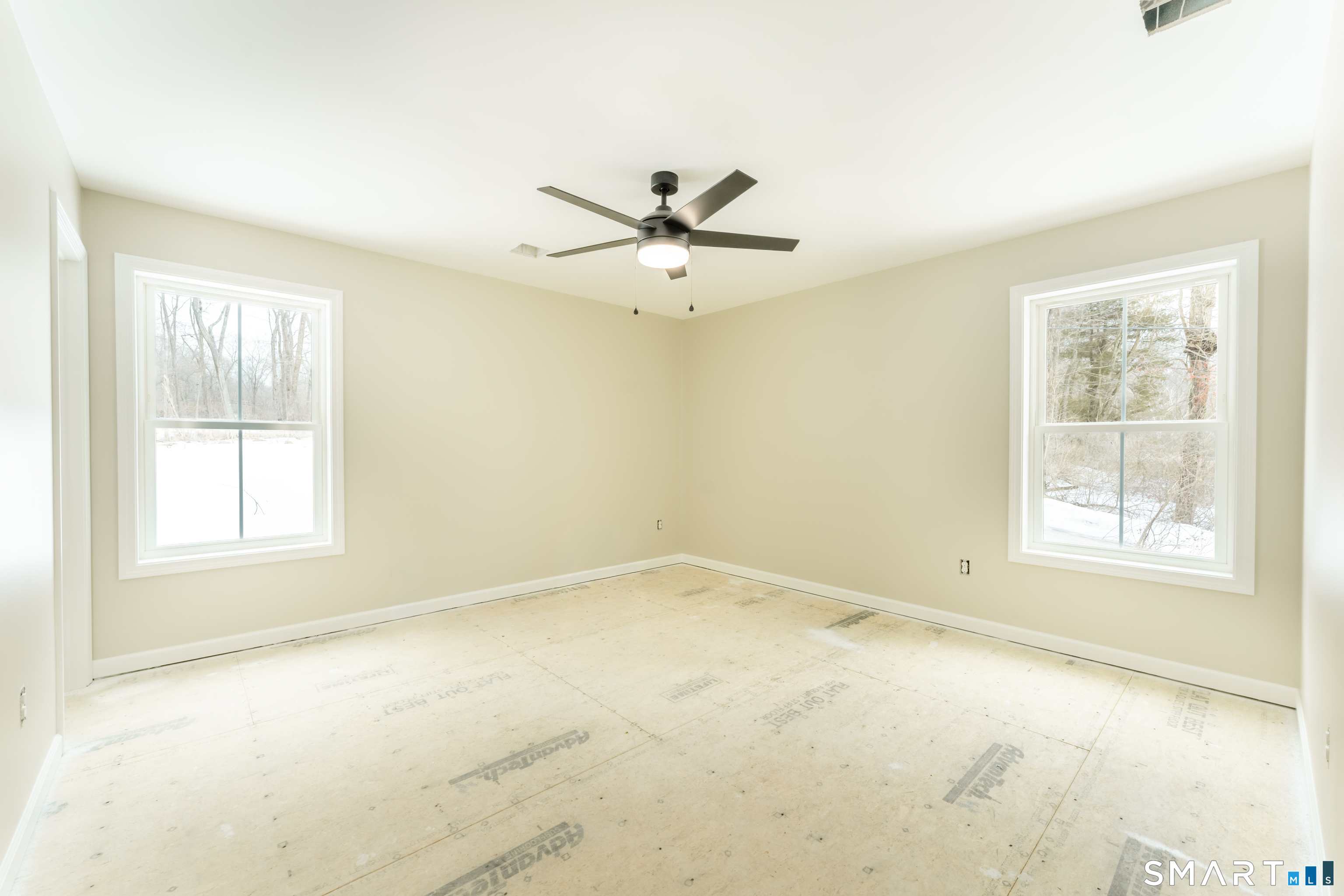 7 Halls Mill Road Preston, CT 06365 - Photo 13 of 26 an empty room with chandelier fan and windows