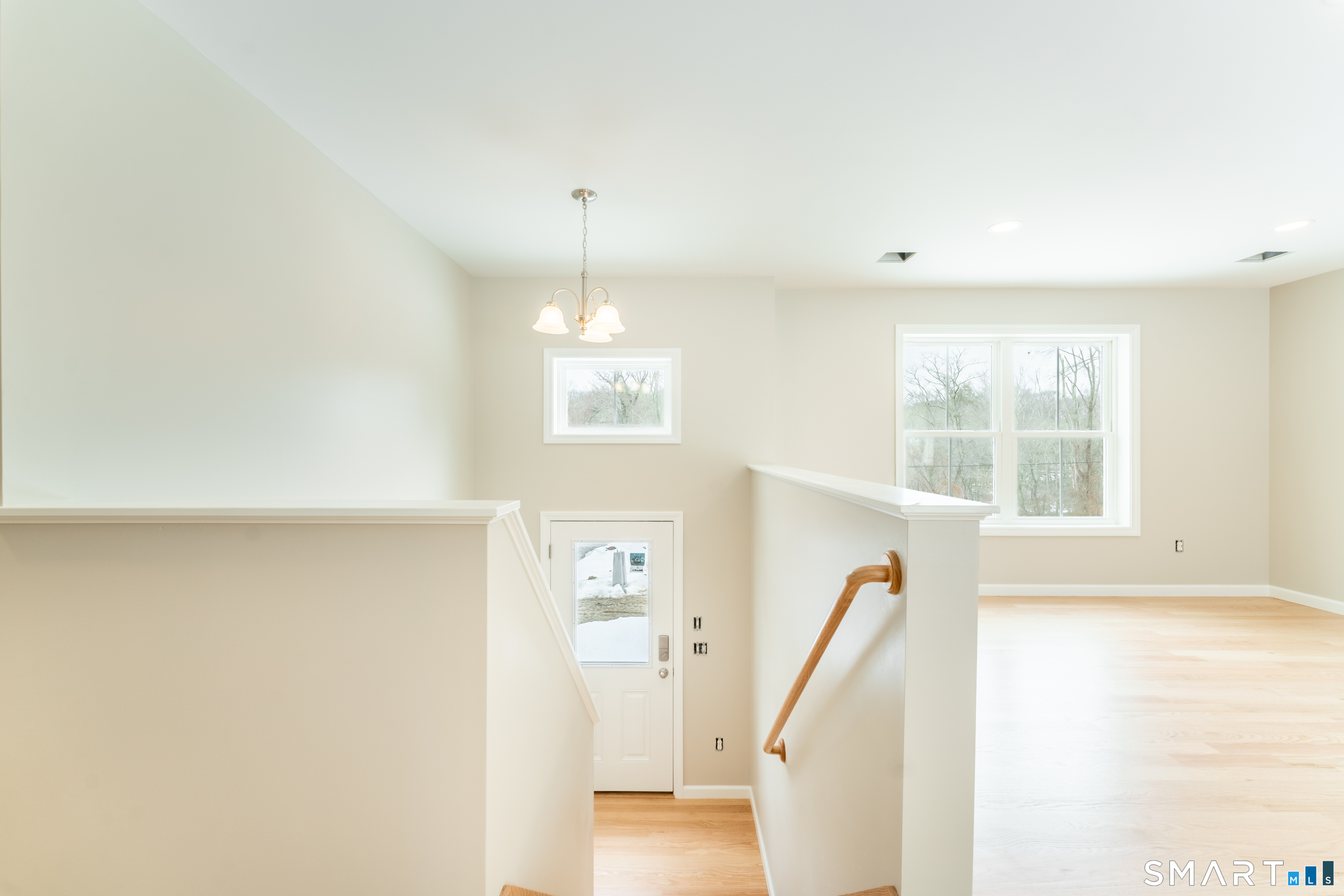 7 Halls Mill Road Preston, CT 06365 - Photo 20 of 26 a view of a livingroom with wooden floor and stairs