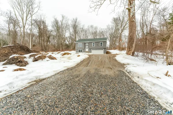 a view of a house with snow on the ground