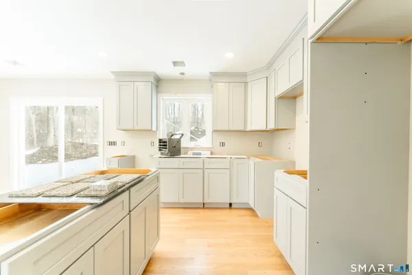 a kitchen with a sink stove and cabinets