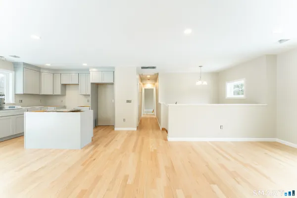 a view of a kitchen with a sink and cabinets