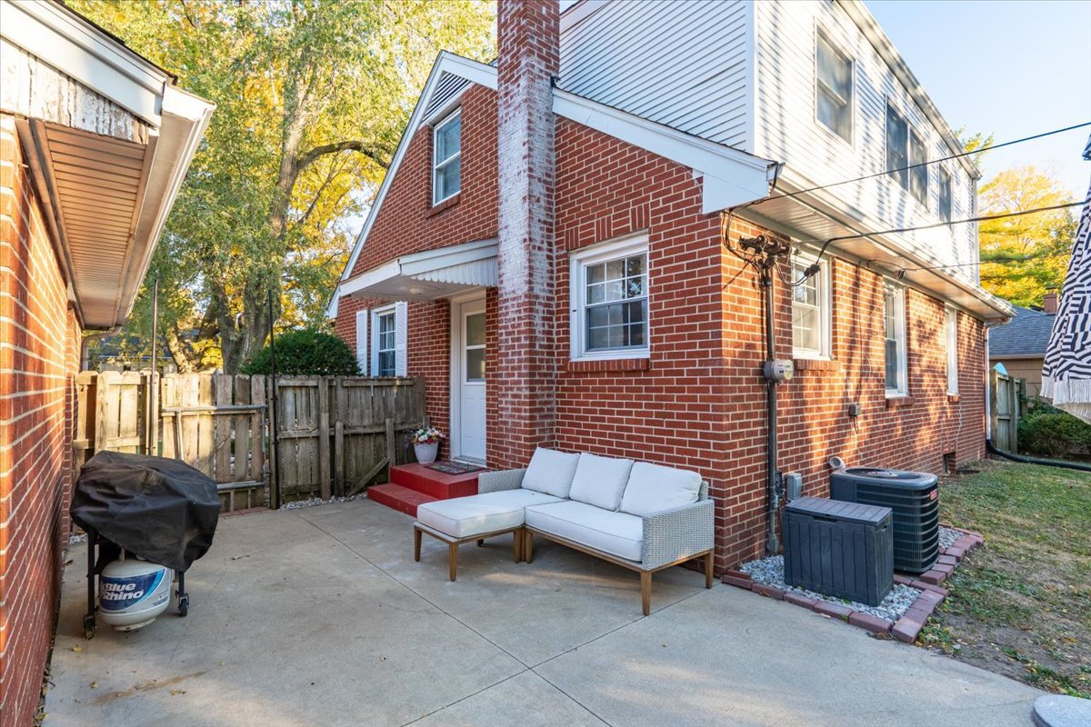 27 University Court Normal, IL 61761 - Photo 24 of 29 a backyard of a house with sofas table and chairs
