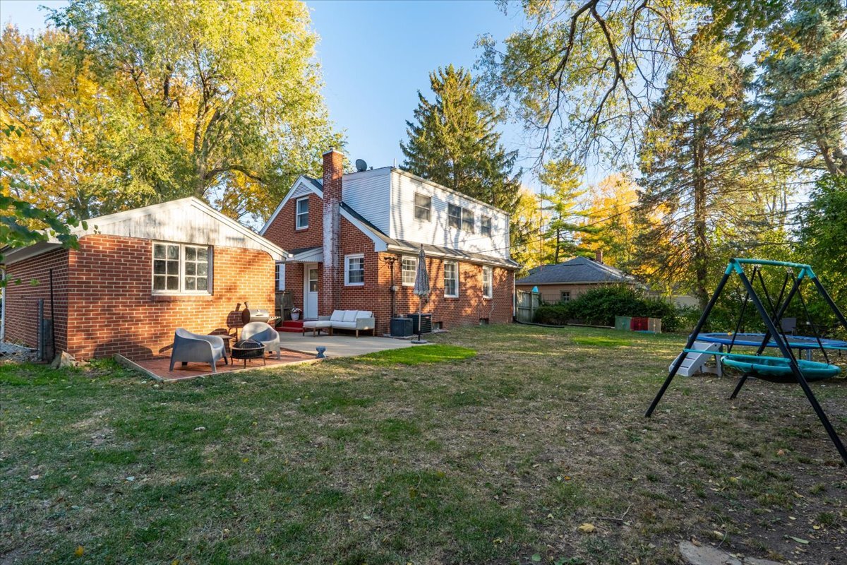 27 University Court Normal, IL 61761 - Photo 25 of 29 a view of a house with a yard and sitting area