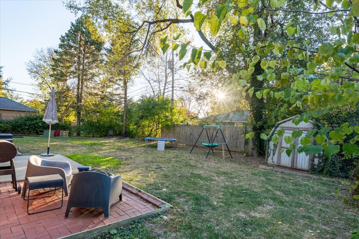 27 University Court Normal, IL 61761 - Photo 26 of 29 a view of backyard with seating area and green space