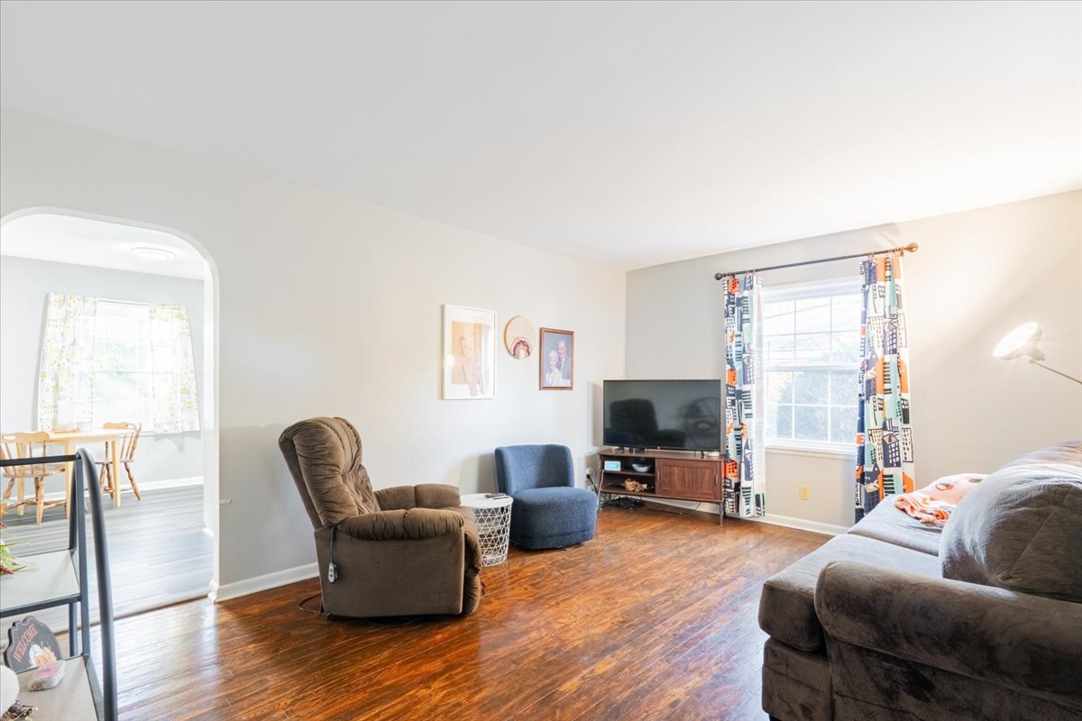 27 University Court Normal, IL 61761 - Photo 5 of 29 a living room with furniture flat screen tv and wooden floor