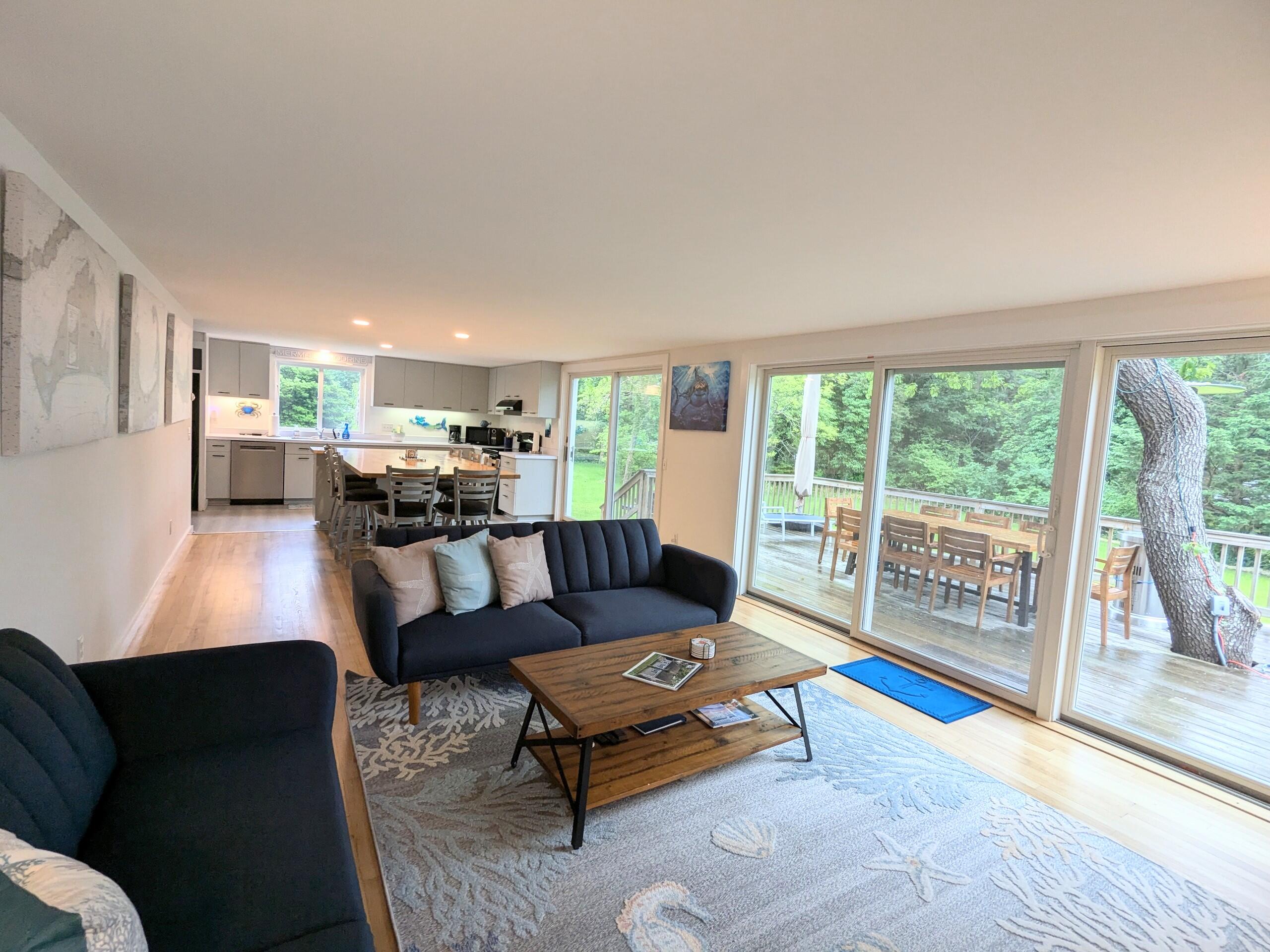 29 Pilgrim Road Dennis, MA 02638 - Photo 13 of 54 a living room with furniture and a large window