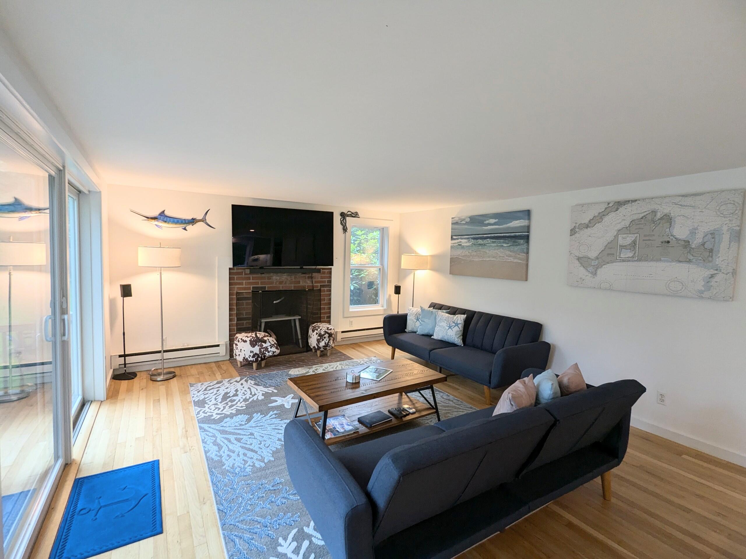 29 Pilgrim Road Dennis, MA 02638 - Photo 14 of 54 a living room with furniture and a flat screen tv