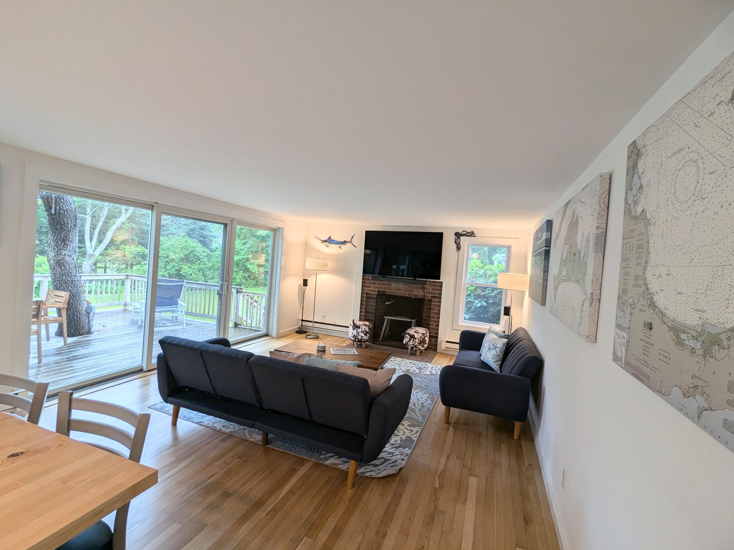 29 Pilgrim Road Dennis, MA 02638 - Photo 15 of 54 a living room with furniture and a flat screen tv