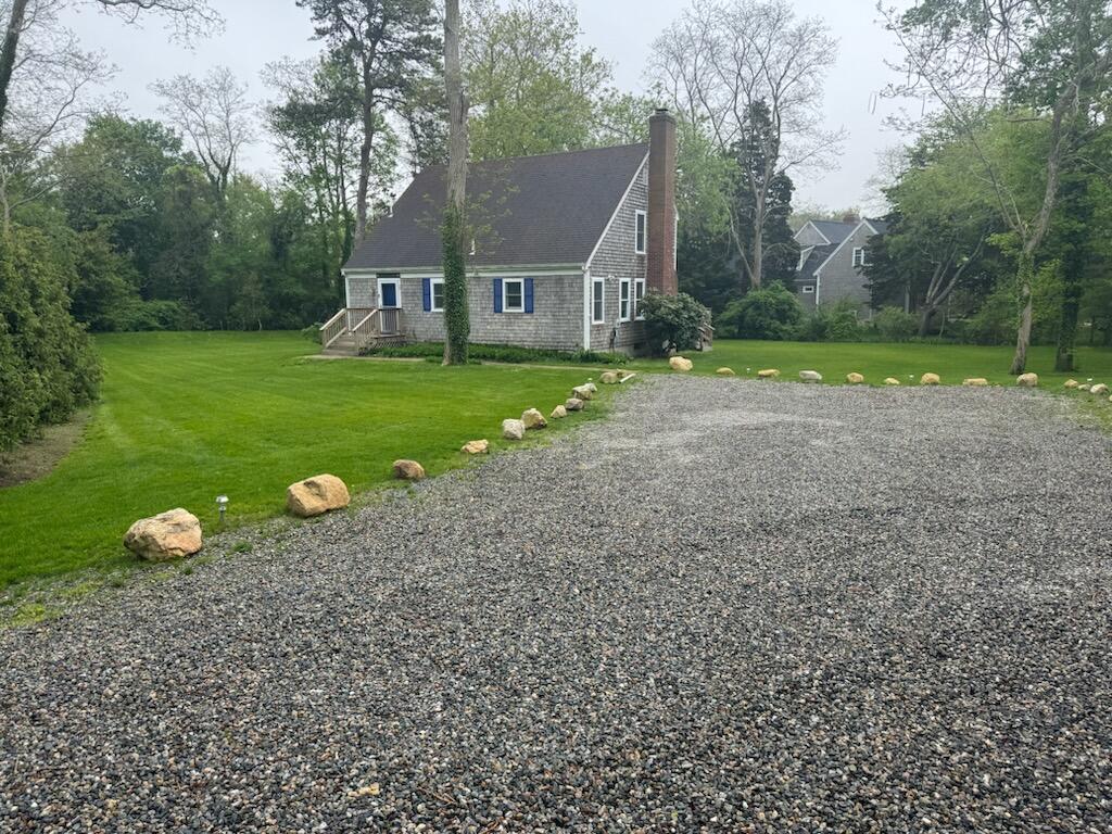 29 Pilgrim Road Dennis, MA 02638 - Photo 2 of 54 a front view of a house with garden