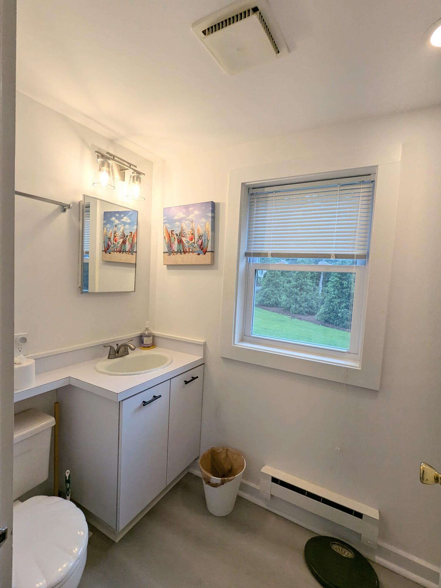 29 Pilgrim Road Dennis, MA 02638 - Photo 30 of 54 a view of a bathroom with a toilet sink and a window