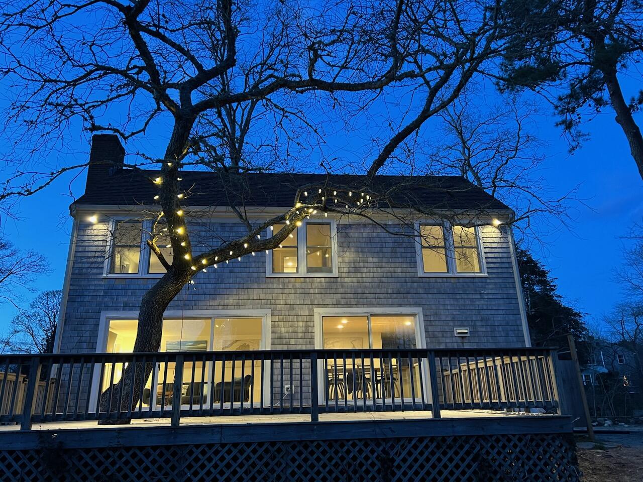 29 Pilgrim Road Dennis, MA 02638 - Photo 37 of 54 a view of a balcony with a tree