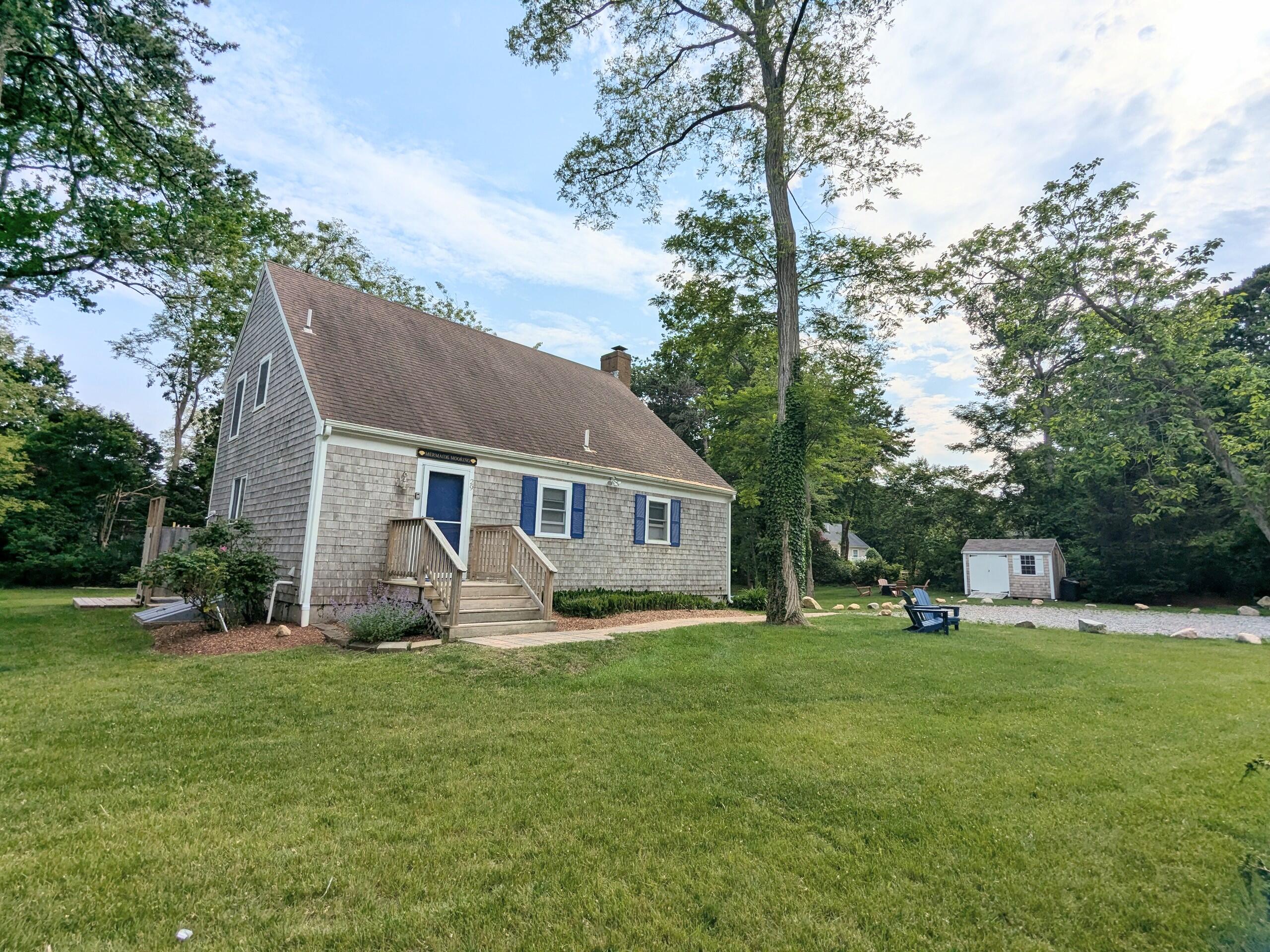 29 Pilgrim Road Dennis, MA 02638 - Photo 7 of 54 a front view of house with yard and green space