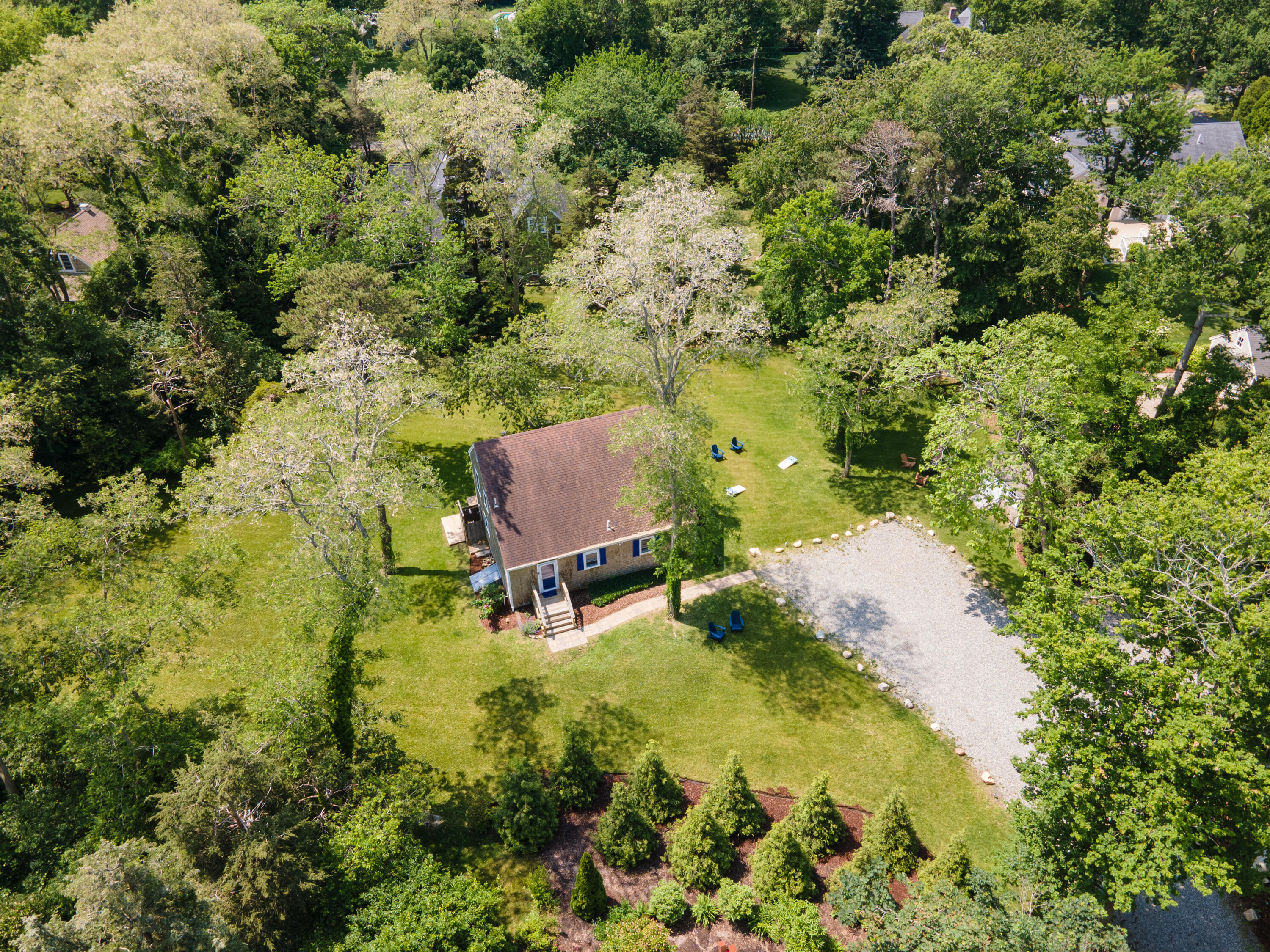 29 Pilgrim Road Dennis, MA 02638 - Photo 10 of 54 a backyard of a house with a yard and outdoor seating