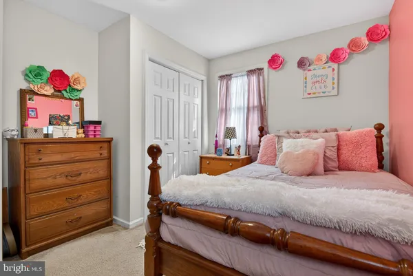 a bedroom with a bed and cabinets