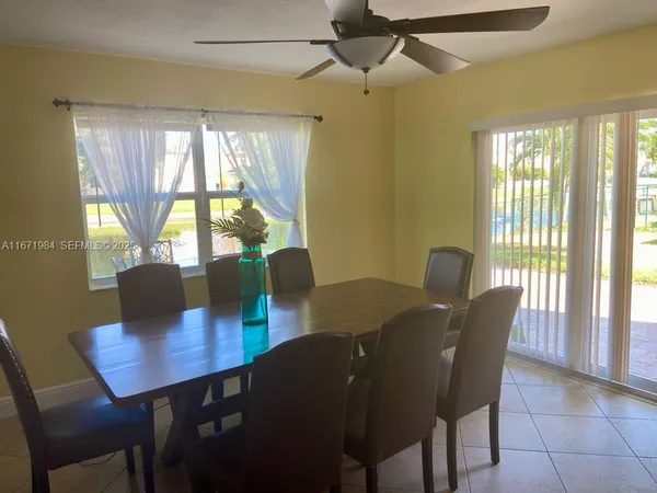 a view of a dining room with furniture window and outside view