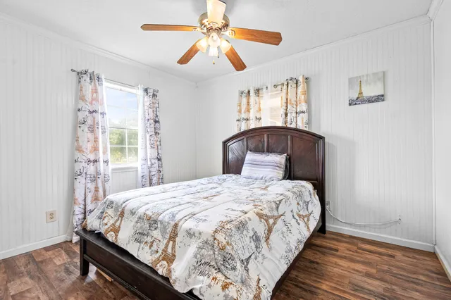 a bedroom with bed and window