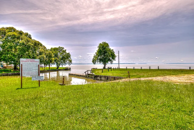 a view of a house with swimming pool and a yard
