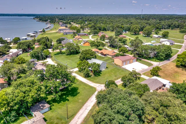 an aerial view of residential house with outdoor space and swimming pool