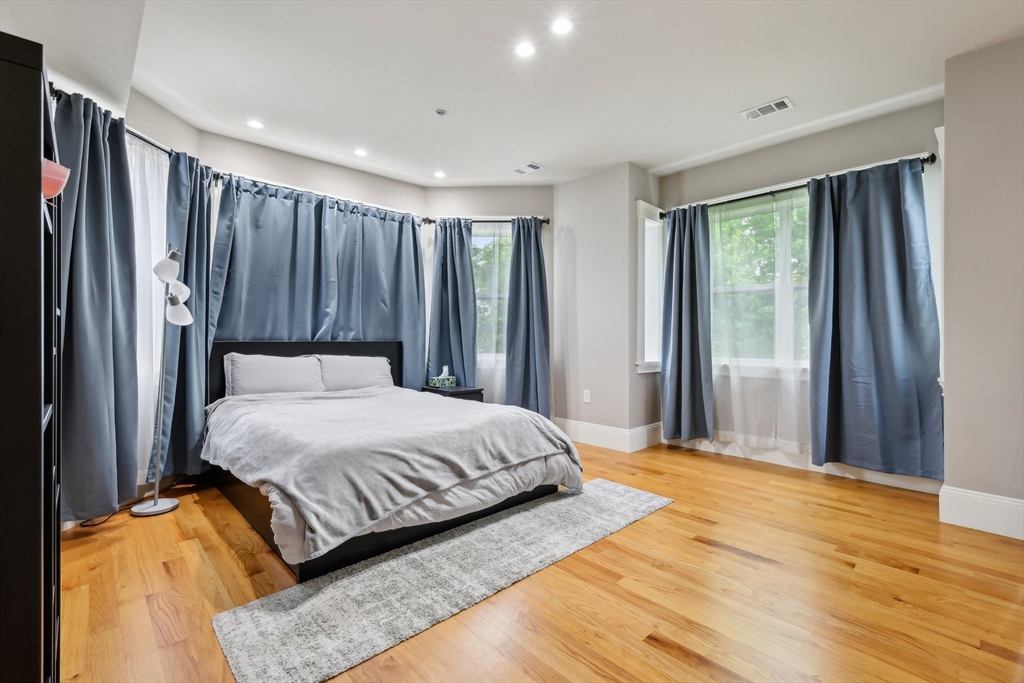 51 Hamilton Street, Unit 3 Boston, MA 02125 - Photo 14 of 21 a bedroom with a bed and a window