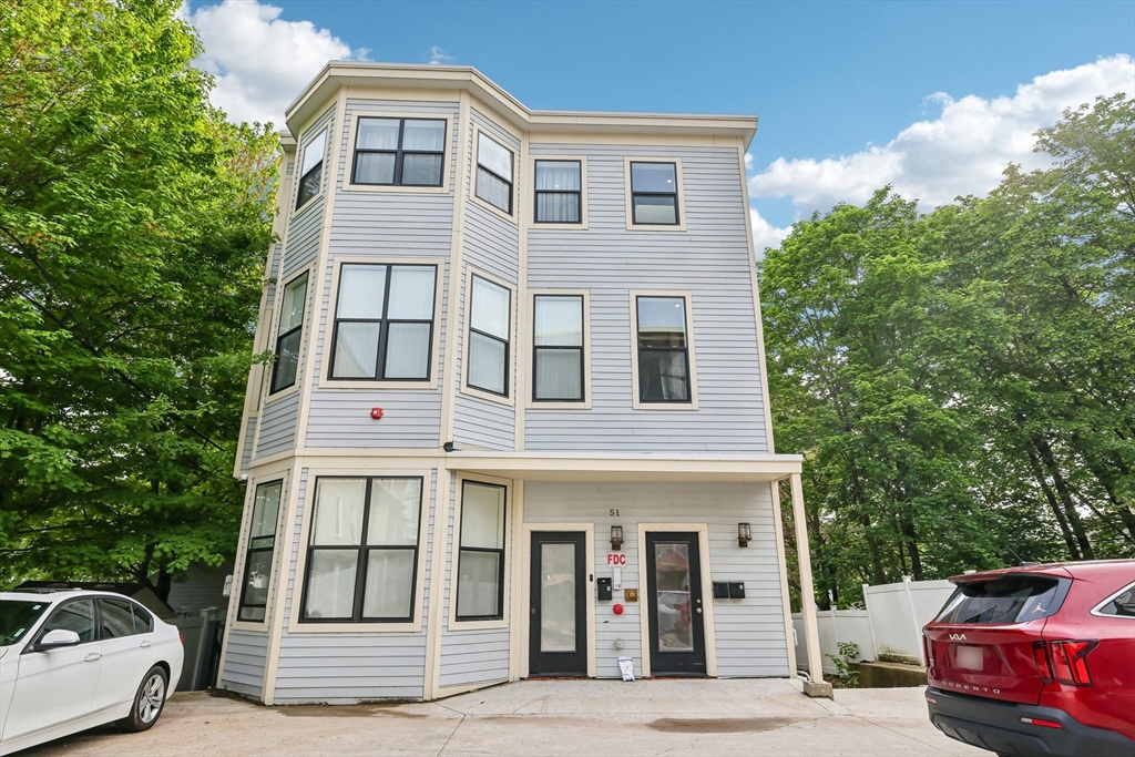 51 Hamilton Street, Unit 3 Boston, MA 02125 - Photo 2 of 21 a view of a car parked in front of a house