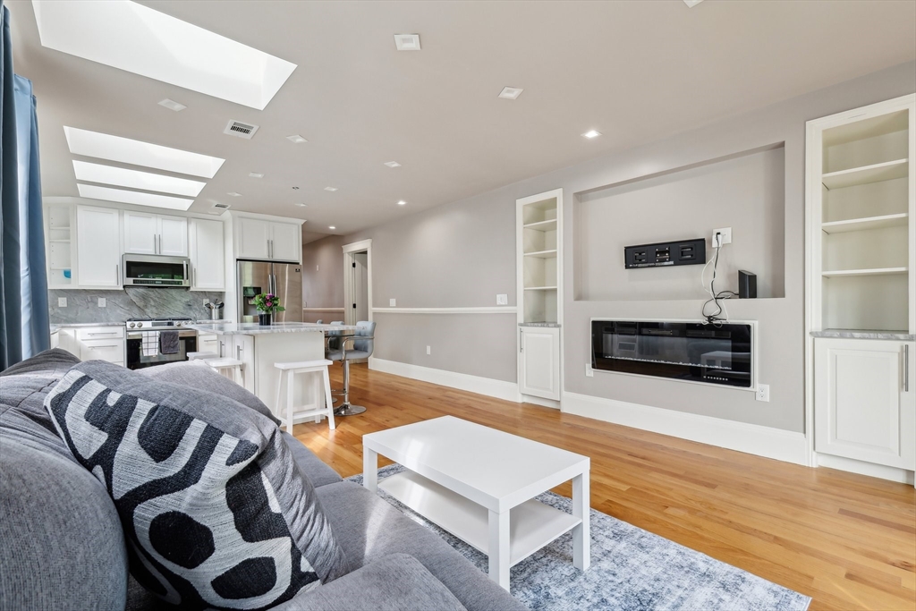 51 Hamilton Street, Unit 3 Boston, MA 02125 - Photo 5 of 21 a living room with furniture and a flat screen tv