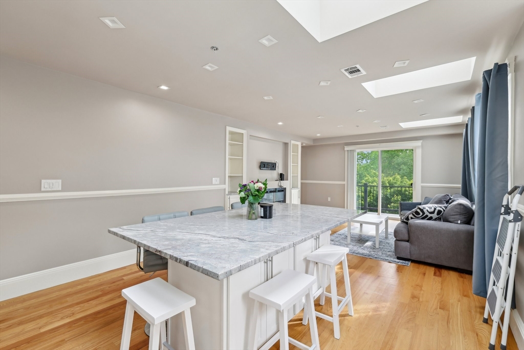 51 Hamilton Street, Unit 3 Boston, MA 02125 - Photo 9 of 21 a view of a dining room with furniture window and wooden floor