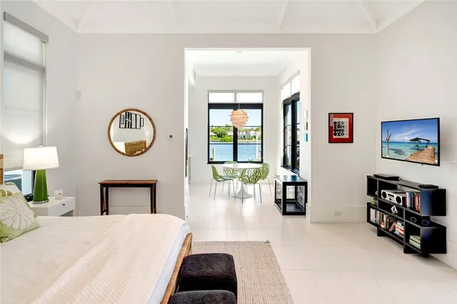 a living room filled with furniture and a chandelier