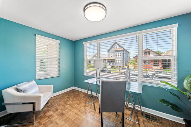 a kitchen with a table chairs and outdoor view
