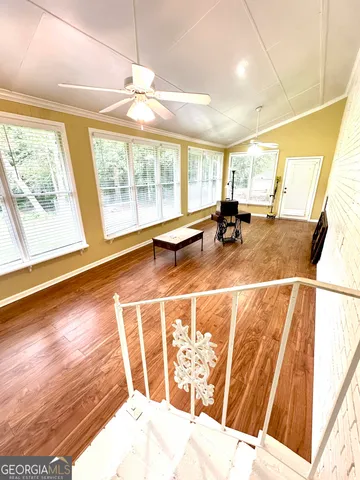 a view of a swimming pool with a patio