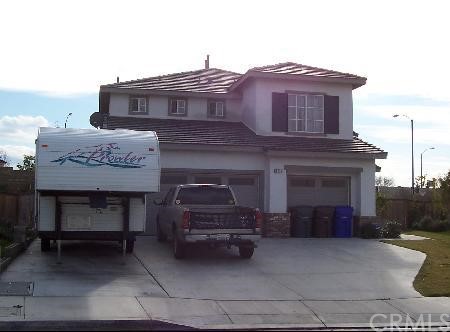 a view of a car park in front of house