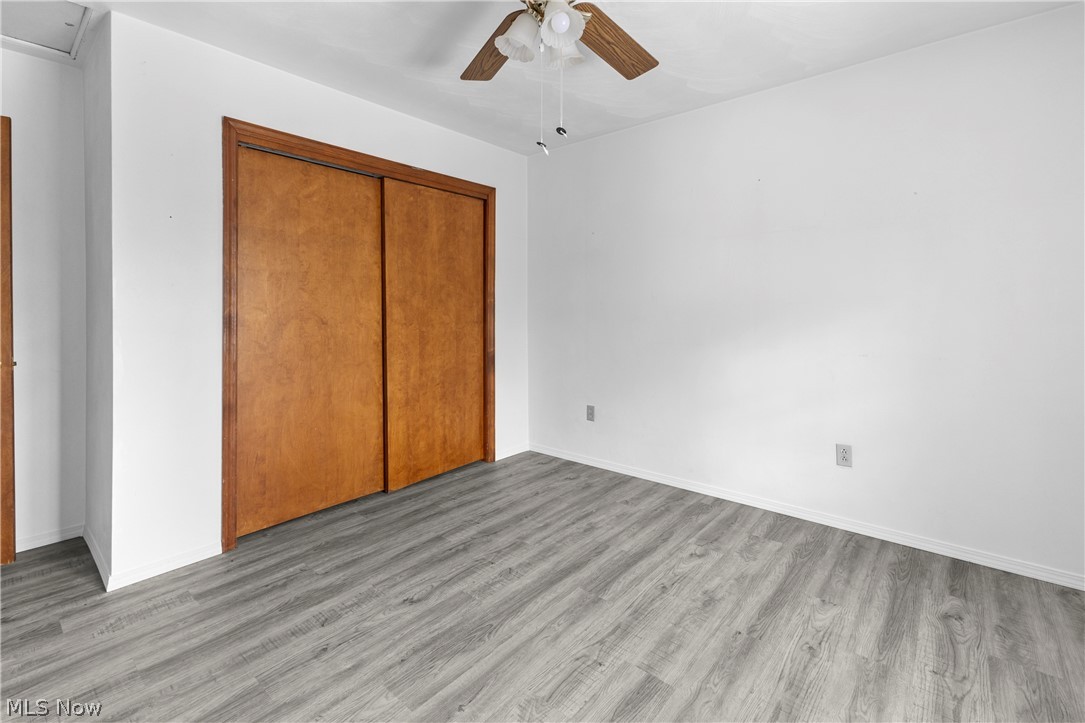 140 Iris Lane Colliers, WV 26035 - Photo 31 of 47 Unfurnished bedroom with ceiling fan, light hardwood / wood-style floors, and a closet