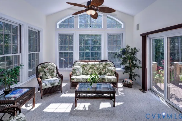 a view of staircase with wooden floor and fan