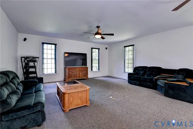 a view of a livingroom with furniture and windows