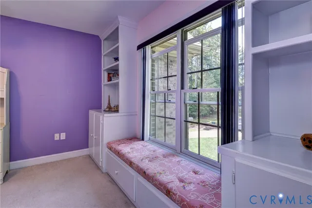 a view of an house with backyard space and balcony