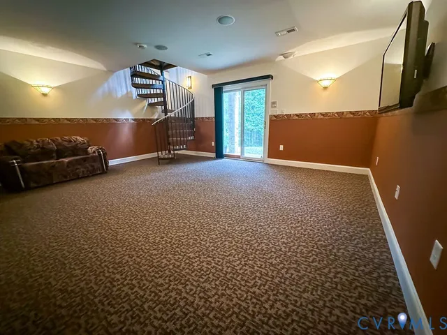 a view of a town with barn in the background