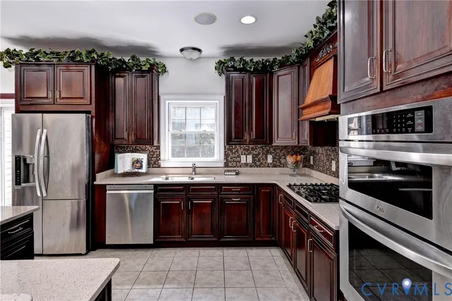 a kitchen with stainless steel appliances granite countertop a sink and a microwave