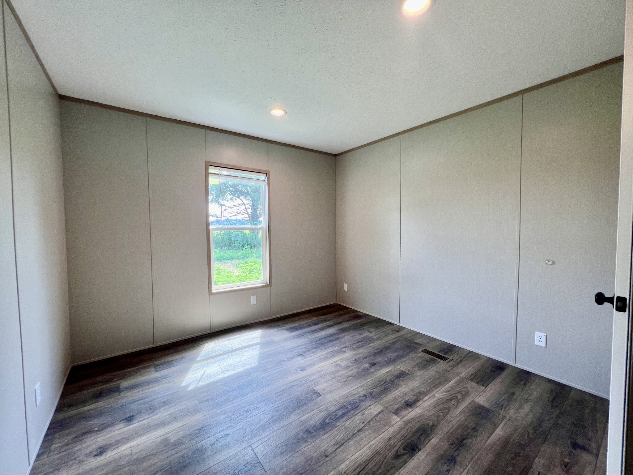 1037 McAfee Road Morrison, TN 37357 - Photo 18 of 23 a view of an empty room with wooden floor and a window