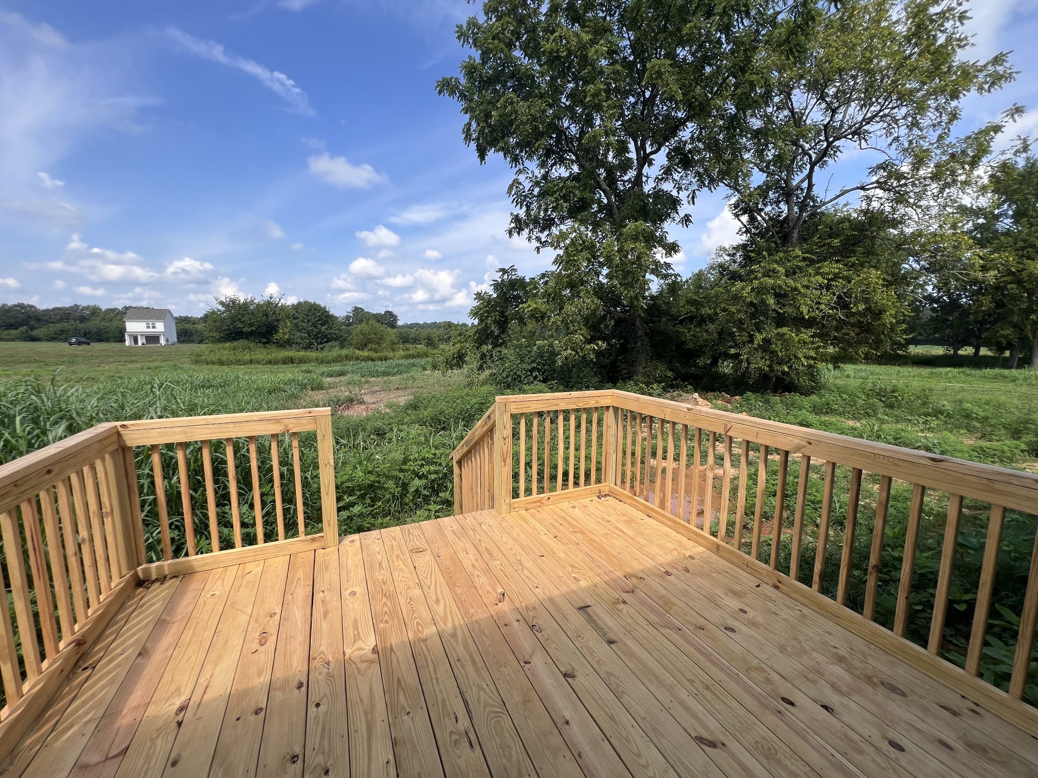 1037 McAfee Road Morrison, TN 37357 - Photo 23 of 23 a balcony with wooden floor and fence