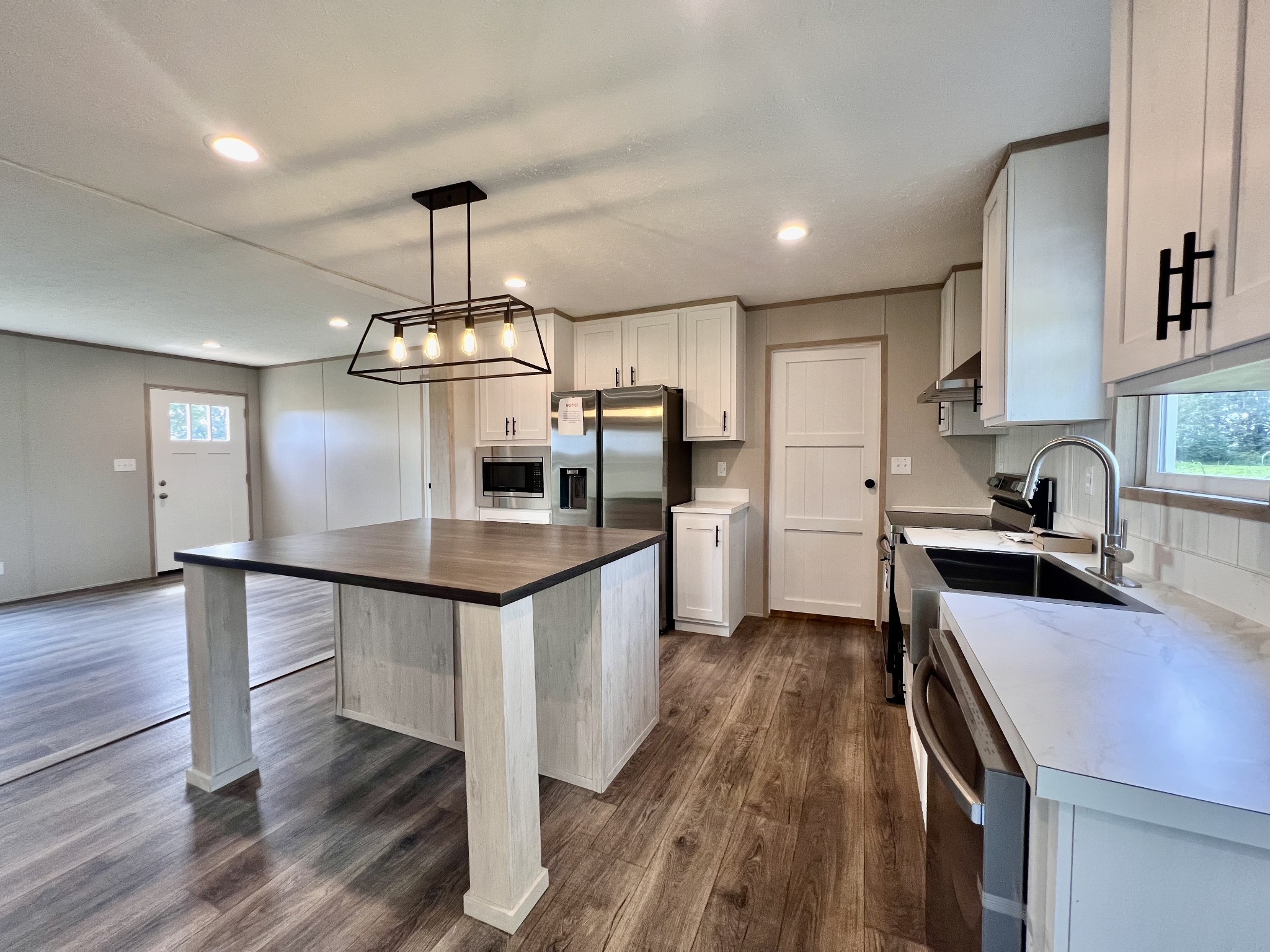 1037 McAfee Road Morrison, TN 37357 - Photo 8 of 23 a kitchen with stainless steel appliances a sink and stove