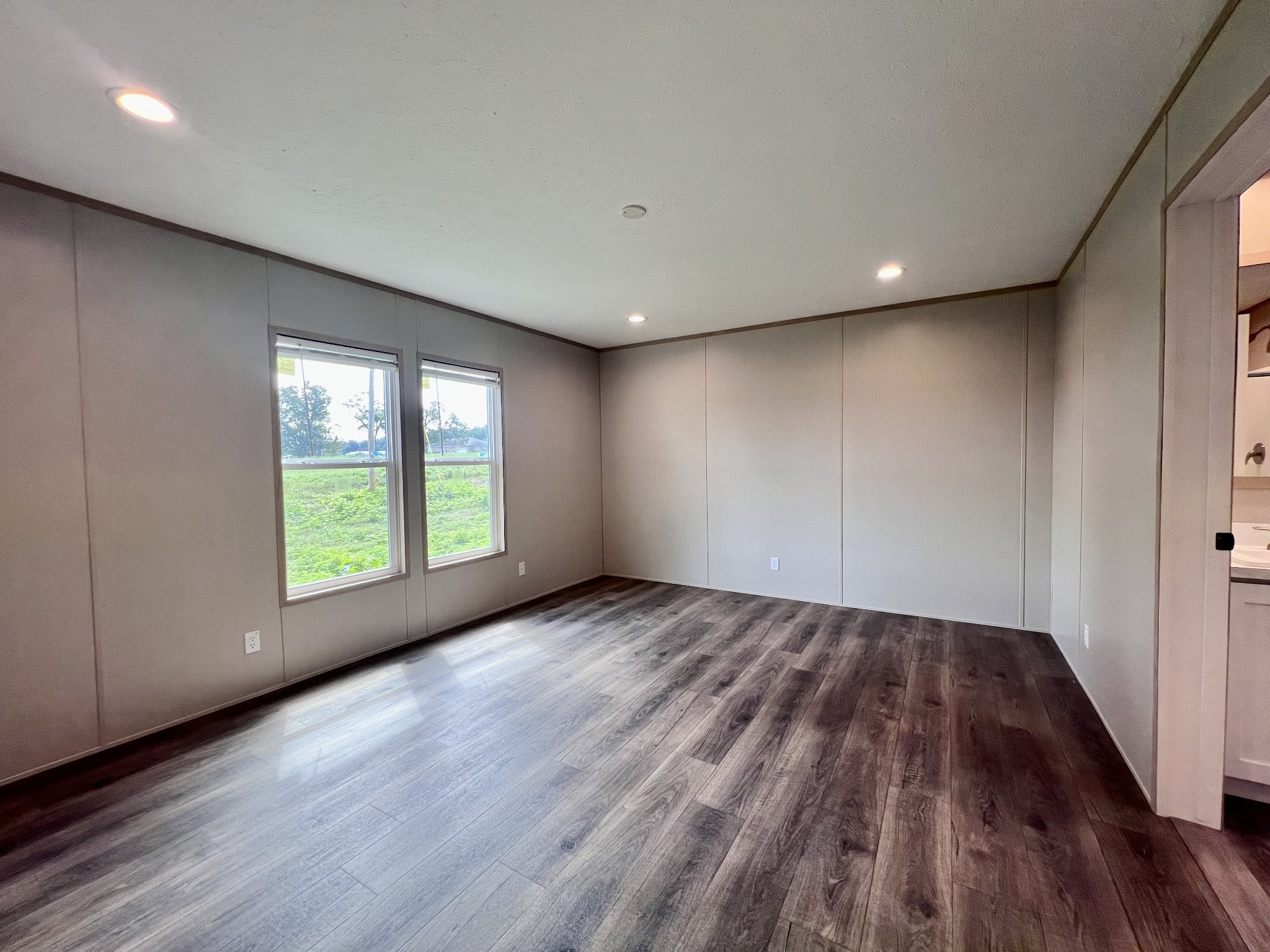 1037 McAfee Road Morrison, TN 37357 - Photo 10 of 23 an empty room with wooden floor and windows