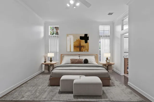 a bedroom with furniture and a mirror