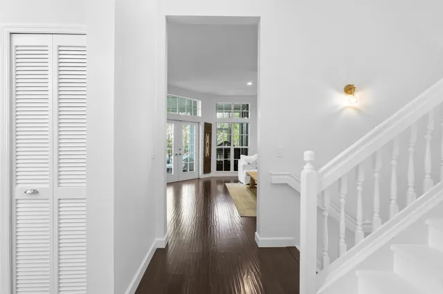 a view of entryway with wooden floor