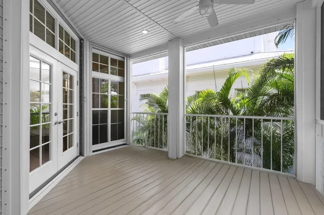 a view of a balcony with wooden floor