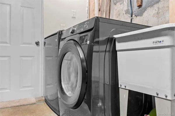 a utility room with dryer and washer