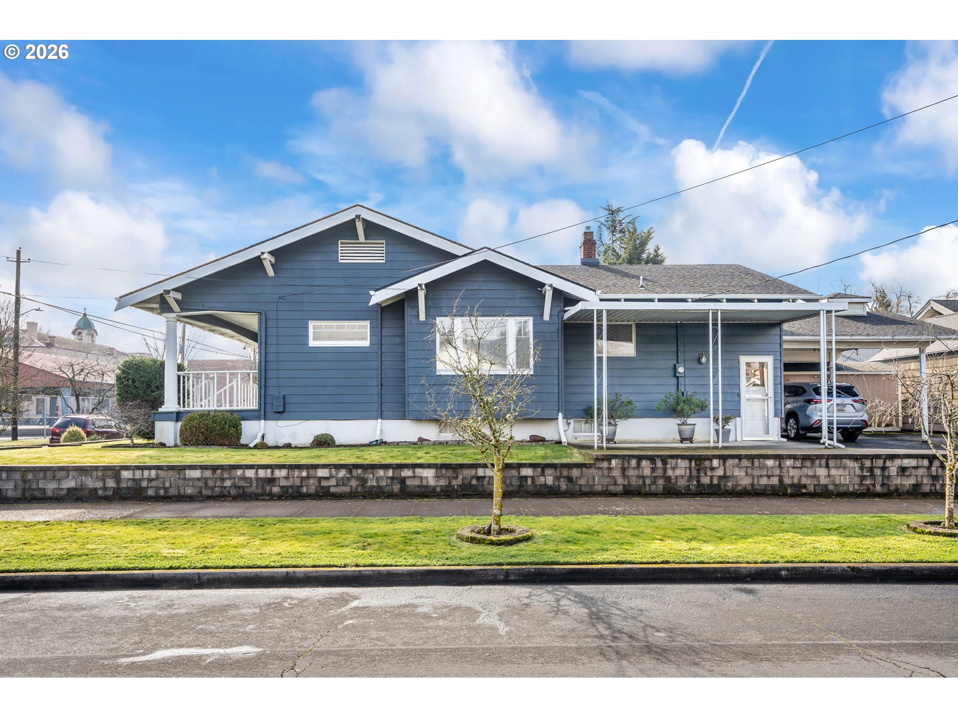 2845 Northeast 53rd Avenue Portland, OR 97213 - Photo 26 of 29 a front view of a house with a yard table and chairs