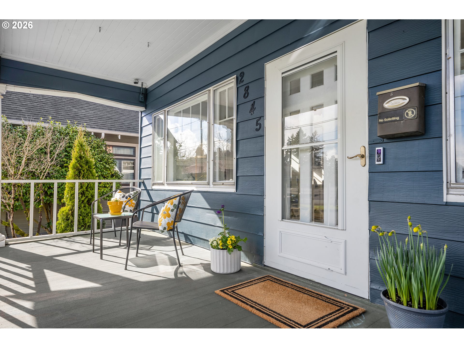 2845 Northeast 53rd Avenue Portland, OR 97213 - Photo 3 of 29 a balcony with couple of chairs and a potted plant
